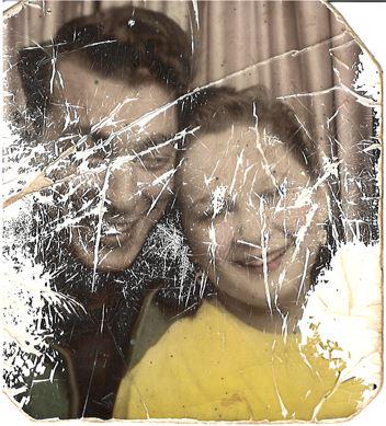 Low resolution scratched vintage portrait before AI restoration